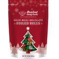 A resealable pouch of Rosalind Candy Castle solid milk chocolate foiled bells, with festive Christmas foils in gold, green, and red colors.