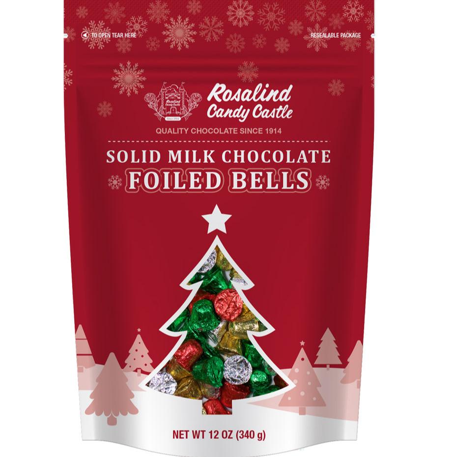 A resealable pouch of Rosalind Candy Castle solid milk chocolate foiled bells, with festive Christmas foils in gold, green, and red colors.